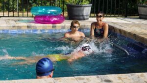 Family watching a swimmer