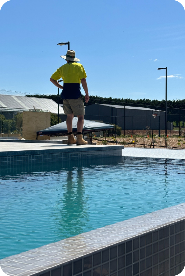 Remco Technician standing on the edge of a pool
